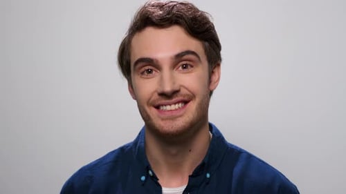 Close Up Young Man Waving Head Yes at Camera. Joyful Guy Posing