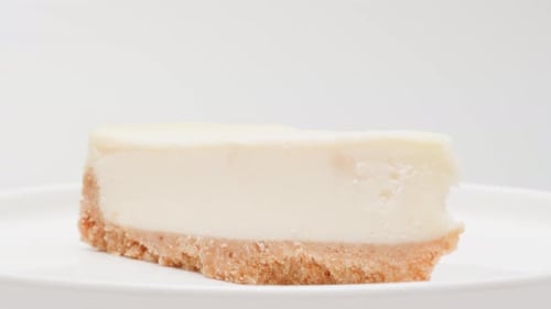 Rotating Slice of Delicious Cheesecake Dessert