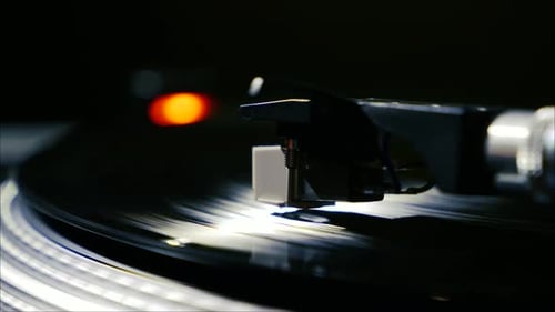 Record Player Needle on Spinning Vinyl Record