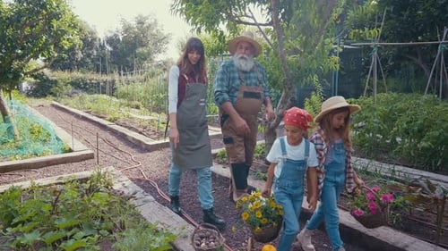 Happy family in a vegetable garden