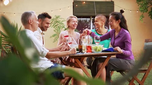 Friends and Family Share Meal Outdoors