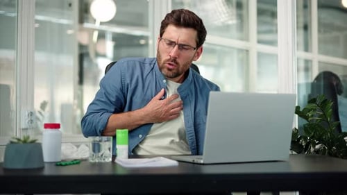 Man at Desk with Chest Discomfort