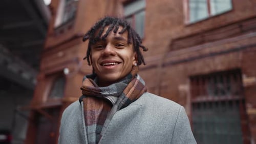 Positive Happy Joyful African American Man Smiling to Camera in City Street Medium Portrait of Mixed