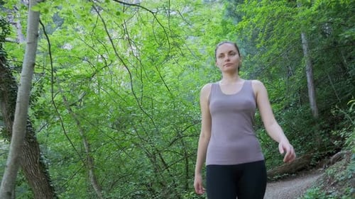 Traveler Woman Hiking on the Forest Trail Path in Mountain Walking on Rocks