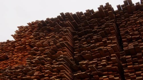 Stacked Lumber Planks Create Abstract Pattern