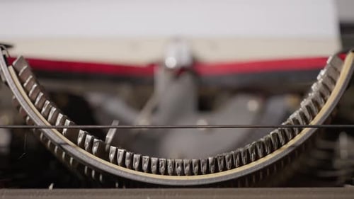 Close-Up Inside Typewriter Mechanism Typing Letters on Paper