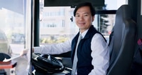 Friendly Bus Driver in City Environment