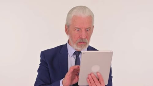 Senior Man Reacting to Tablet