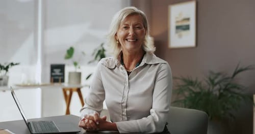 Laptop, mature and face with business woman in office for email, administration manager