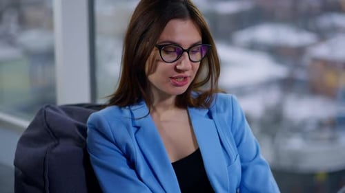 Two Stylish Women Discuss Business in Modern Office