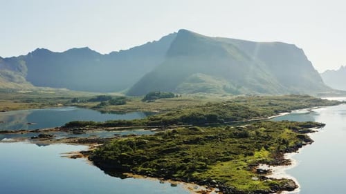 Mountain Range By The Calm Waters Of A Lake