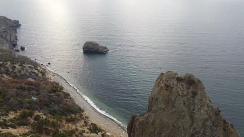 Aerial View on Calm Azure Sea and Volcanic Rocky Shores Small Waves on Water Surface Nature Summer