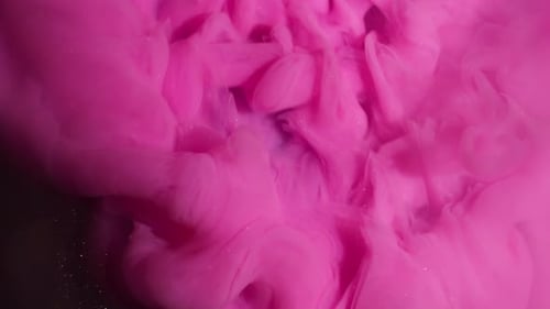 Pink Ink Cloud Expanding on Black Background