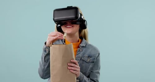 Popcorn, VR or woman in studio for movie with snack for watching tv or film on blue background