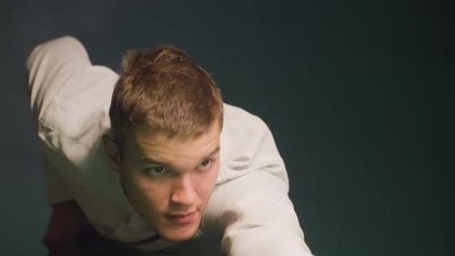 Man Concentrates While Playing Billiards