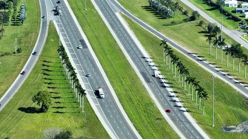 Aerial View of Freeway Overpass Junction with Fast Moving Traffic Cars and Trucks in American Rural