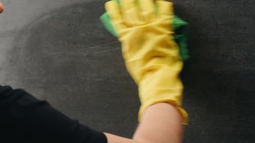 Cleaning Service Close Up of Woman Cleaning Table at Home with Spray Homework Clean of Ditry Kitchen