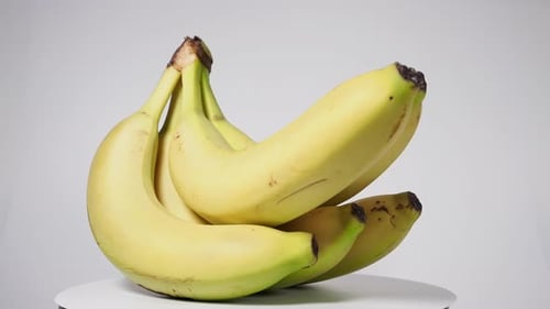 Rotating Bunch of Fresh Yellow Bananas