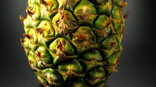Macro video of a whole pineapple captured with a probe lens
