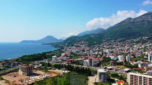 Beautiful city Bar locating on the slopes of green mountains in Montenegro.