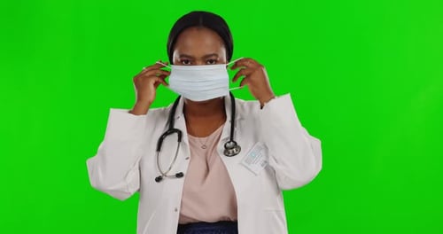 Green screen, black woman or doctor mask, thumbs up and healthcare on a studio background