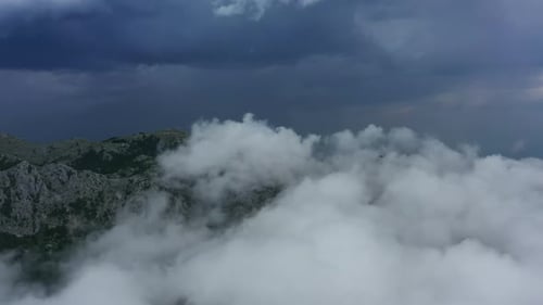 Aerial View of Clouds and Mountains
