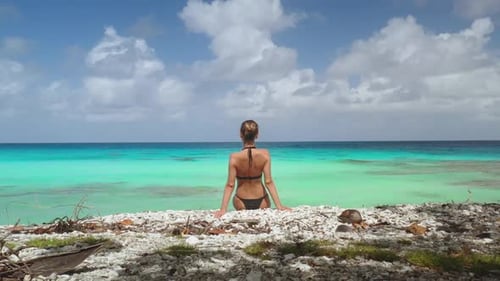 Young Woman Relaxing on Beautiful Tropical Beach with Turquoise Water