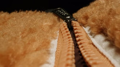 Close Up of Zipper on Fuzzy Brown Fabric
