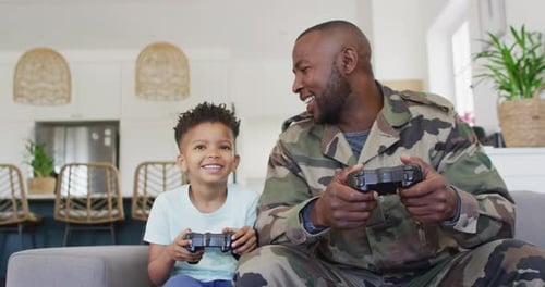 Father and Son Playing Video Games at Home
