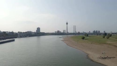 Aerial view of Rhine river with cargo boats cruising, Dusseldorf, Germany
