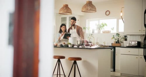 Couple Cooking Together in Modern Kitchen