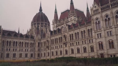 The Historic Hungarian Parliament Building In Budapest Hungary With Ornate Gothic Exterior Design -