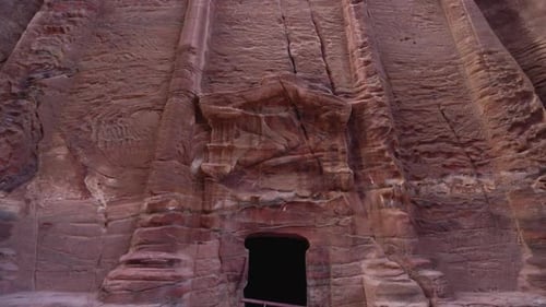 A Reveal Shot of Ancient Temple Facade Carved Out of the Sandrock in Ancient City of Petra