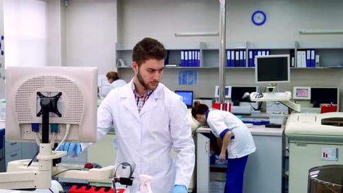 Scientist Working in Bright Modern Laboratory