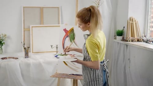 Professional Artist Girl Drawing Abstract Picture in Workshop Bright Colors Talented Woman Painter
