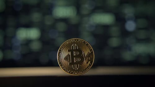 Bitcoin Coin with Green Numbers Background