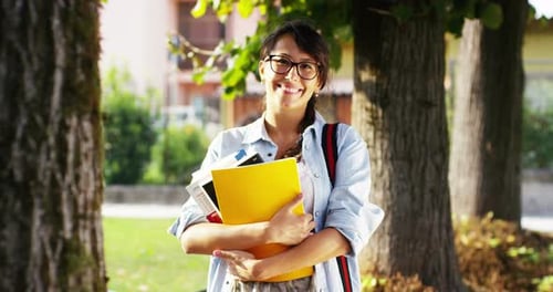 student relaxes by reading and studying a pleasant topic at park. connection concept and tranquili