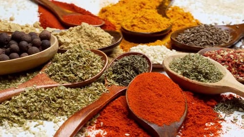 Colorful Spices in Wooden Spoons