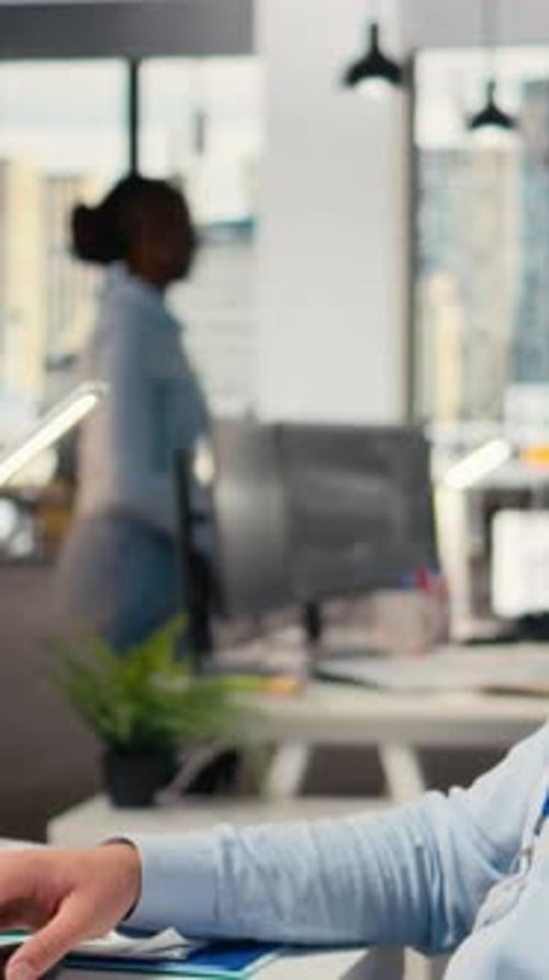 Vertical Video Trader with Smile on Face in Office Looks Upward Visualizing Financial Success