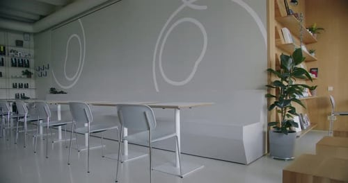 Stylish Cafe with Modern Interior and Comfortable Seats with Tables Indoors