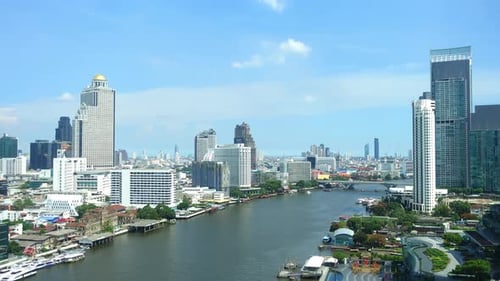 Time-Lapse of brisk river traffic along the Chao Phraya River Bangkok, Thailand.