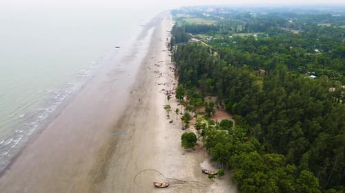 Bangladesh Bay of Bengal Kuakata coast natural sea beach with forest clean empty secluded beach