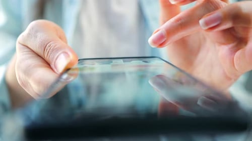 Woman Scrolling Through Social Media Feeds on Smartphone Close Up