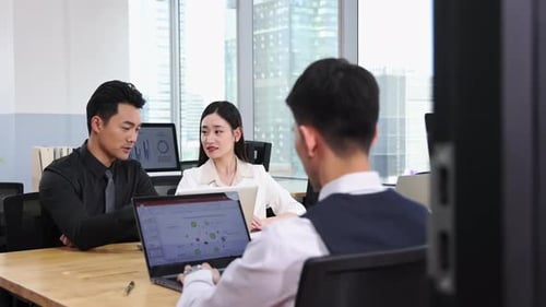 Team Collaboration in Modern Office with City View