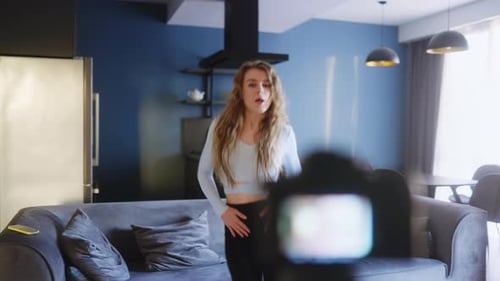Young Woman Dancing at Home for Video Recording