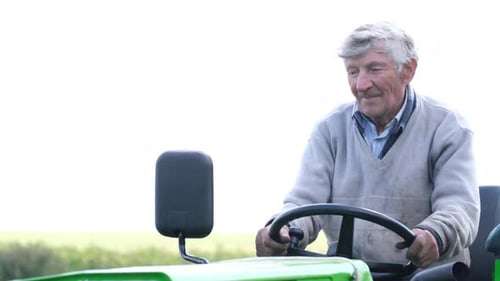 Senior Old Man Driving Small Tractor in Field Agroindustry Agribusiness Farming Agriculture