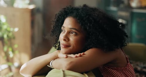 Woman Resting Peacefully on Couch Indoors in Sunlight