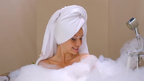 Woman Relaxing in a Luxurious Bubble Bath