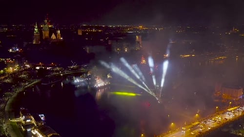 Fireworks over Wawel Royal Castle and Vistula river in Krakow during Dragon Parade, Poland.