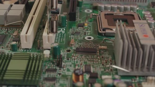 Macro Footage of Green PC Electronic Chip Board Closeup Motherboard with Tech Parts and Connection
